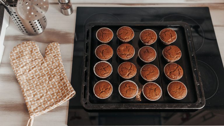 Chocolate muffins bakery. Brownie cupcakes on the baking pan. Baking at home, home bakery.